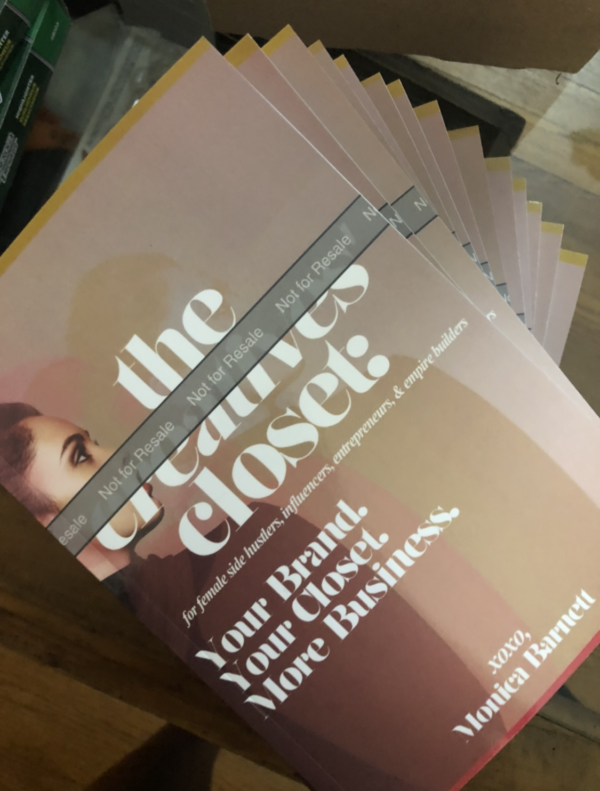 A stack of gallery copies of The Creatives' Closet