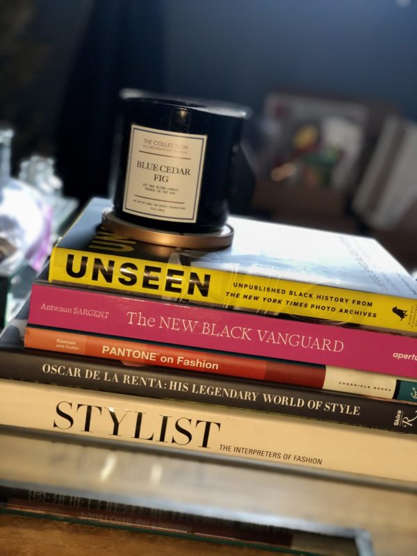 A book stack from a personal stylist, and includes Pantone, book by Antwuan Sargent and more